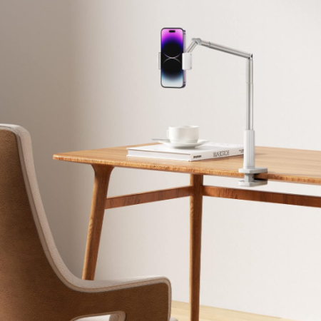 Telescopic-arm clamp-on holder for desks and beds